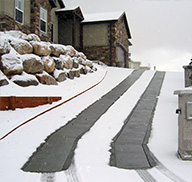 Driveway with heated tire tracks.