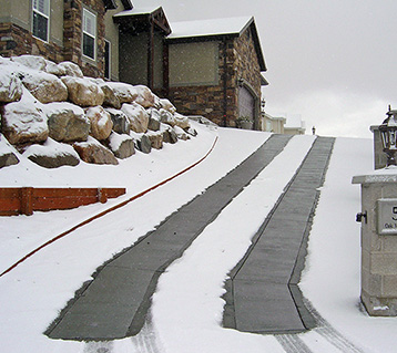 A heated driveway with heated tire tracks.