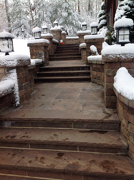 Heated paver steps and walkway after a snowstorm.