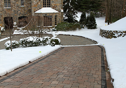 A snow melting system installed to heat a paver driveway and parking area.
